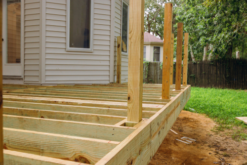 a home that is having a front deck installed